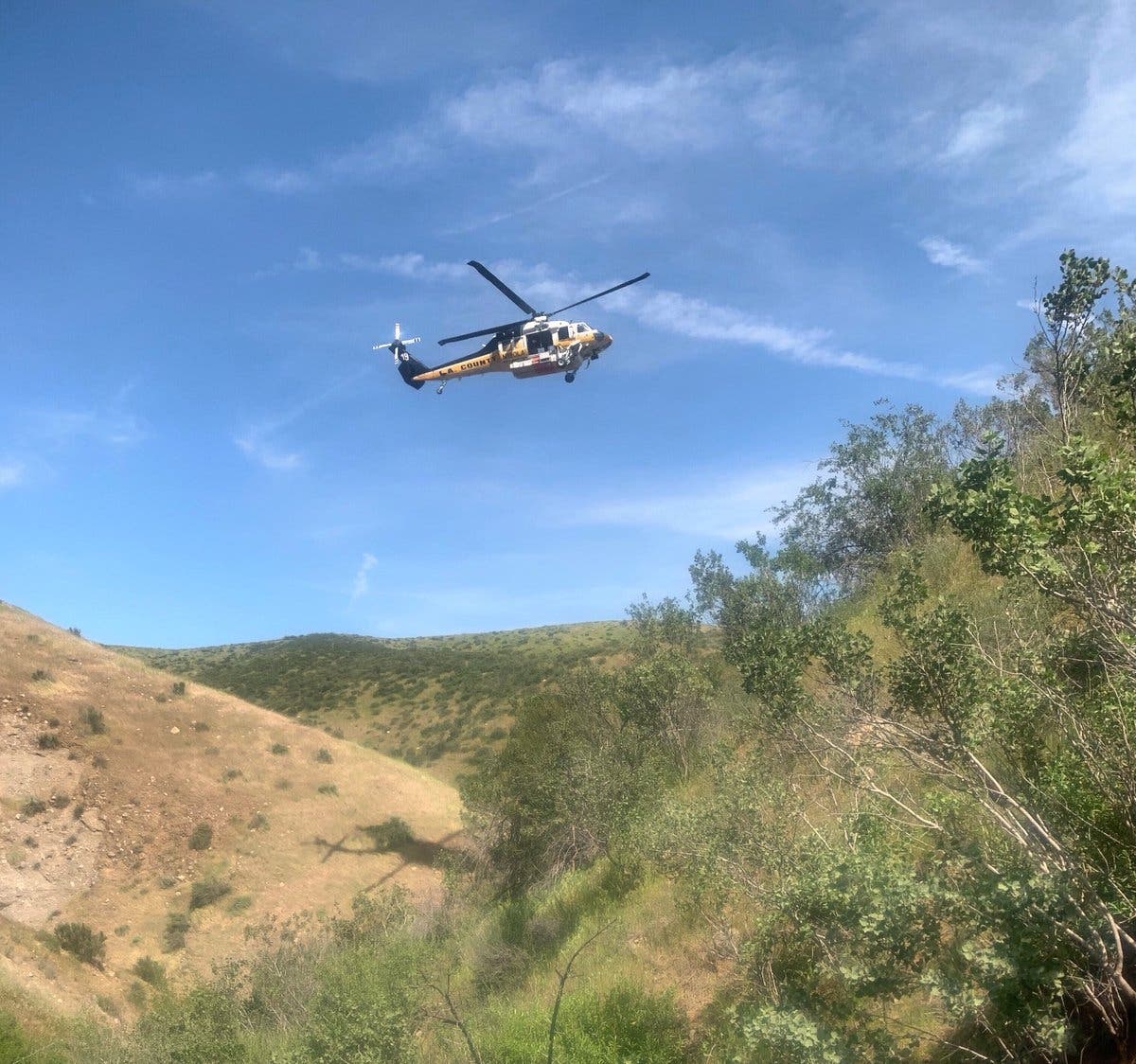 Crews were attempting to recover at least one body after a car fell into the Glendora reservoir.