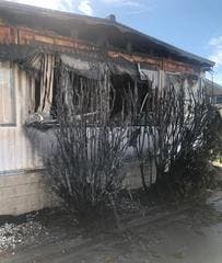 A man was arrested and charged with arson after video footage showed the mobile home catching fire.
