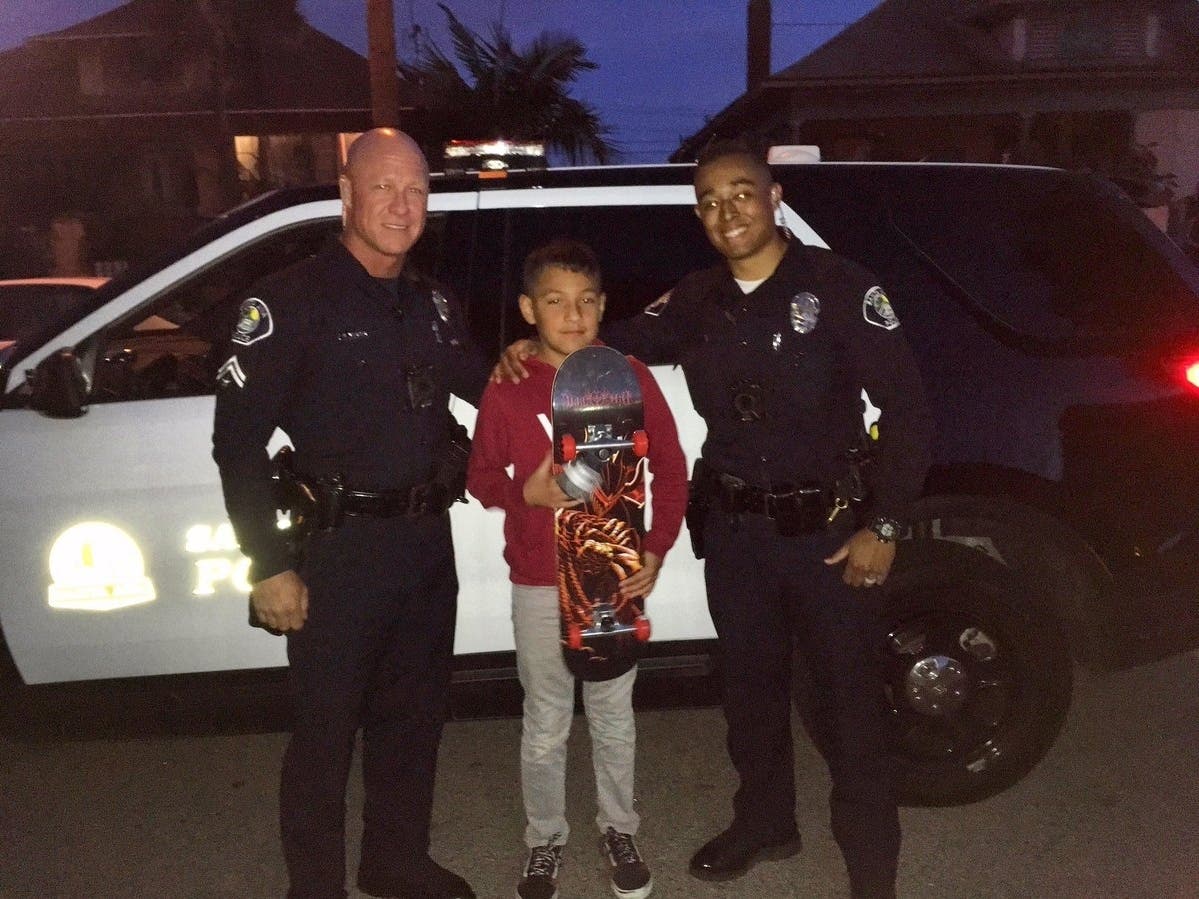 Police bring smiles to boy whose skateboard was stolen.