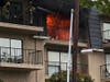Flames engulfed the Seal Beach area apartment on Sunday.