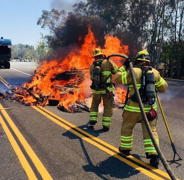 In 2018, a street in Lake Forest was closed down while OCFA firefighters handled this rubbish fire.