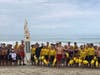 San Clemente Marine Safety Division Capts, Lieutenants and Cadets from Junior Lifeguard section, gather to welcome paddle board as it enters SC City jurisdiction from CA State Parks. 