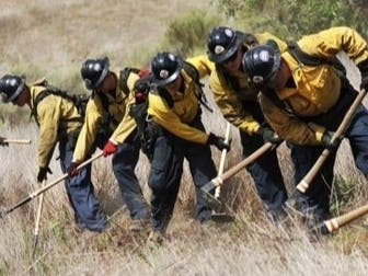 Lending a hand building the fire line at the Riverside County Reche Fire.