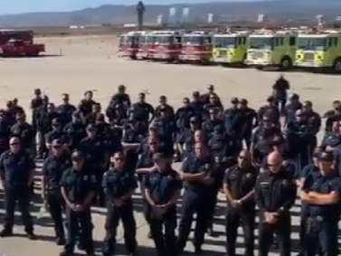 Orange County Fire Authority briefs up-staffed firefighters on impending fire, wind and weather issues.
