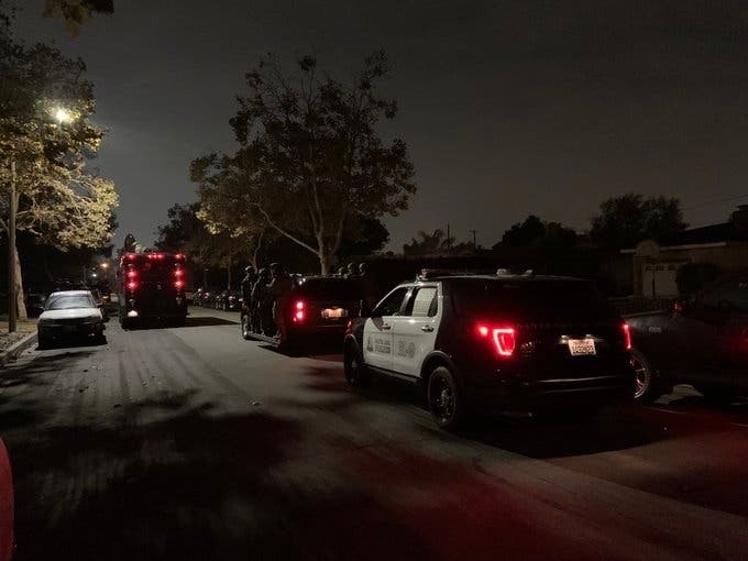 A Santa Ana neighborhood was flooded with police cars during the serving of arrest warrants.