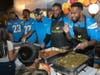 Los Angeles Chargers serve a buffet-style Thanksgiving dinner to those present, with help from the United Way Orange County.