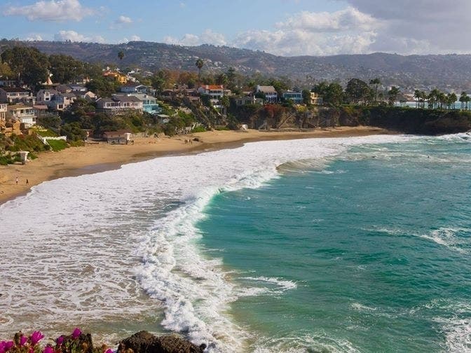 Another swell heads to Orange County beaches the first week of December as miles of coastline remain under bacteria advisory.