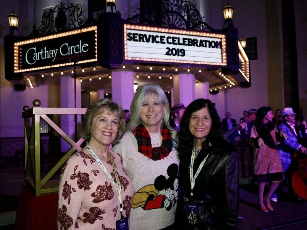 Castmembers smile for Service Celebration night, 2019.