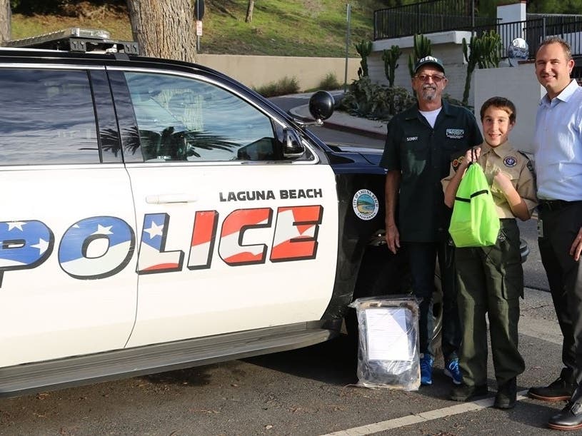 Laguna Beach resident Brooks, with Jordan Villwock of the Laguna Beach Police Department.