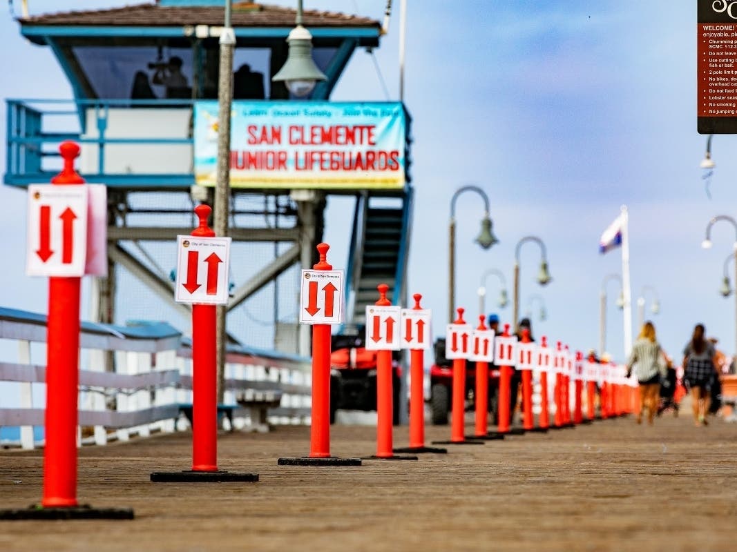 The city council was deadlocked Tuesday on whether to remove fences from beach parking areas near the pier.