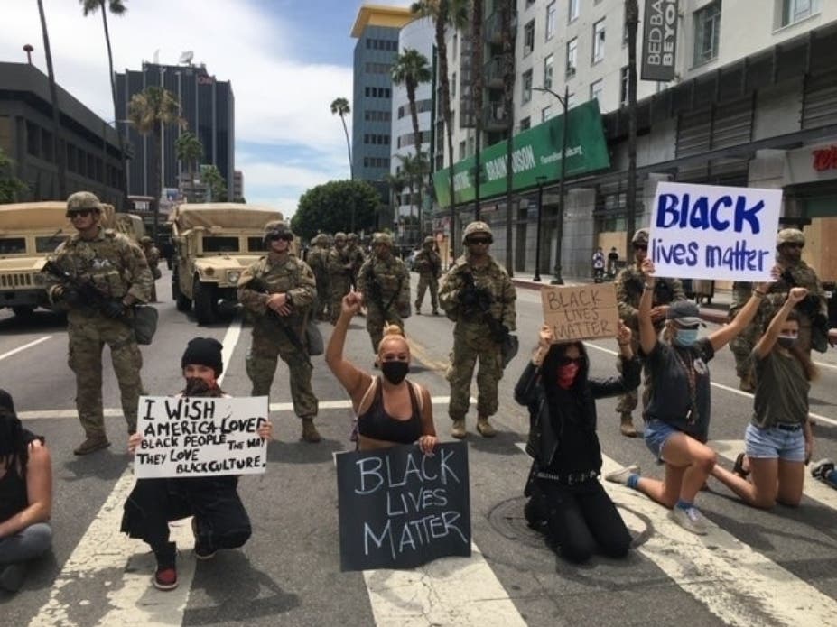 A protester engaged in a war of words with a bathing suit-wearing man in Newport Beach. Then, as video shows, a gun was pulled.