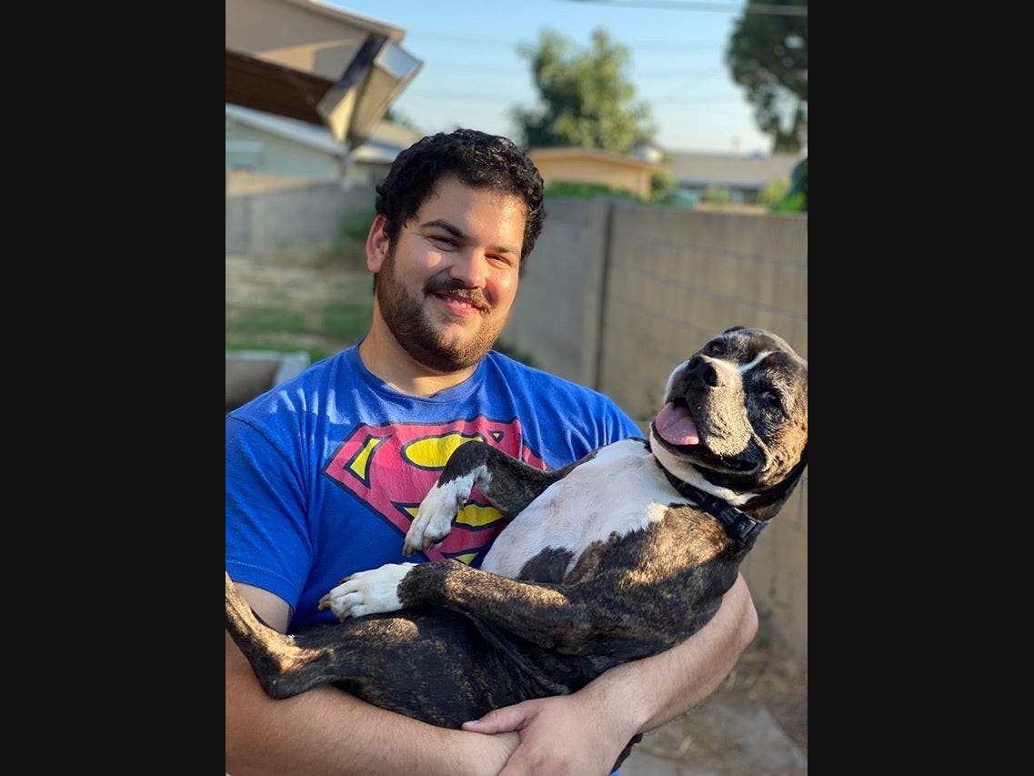 A foster family took in this senior Pittbull terrier, and made him their own.