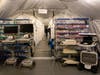 The parking lot of this Orange County hospital is now filled with added beds for anticipated patients infected with COVID-19. 