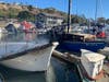 Seven boats were burned at Dana Point Harbor, and one person declined to be transported to the hospital. Investigators are en route. 