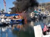 Boat in Dana Harbor fully aflame.