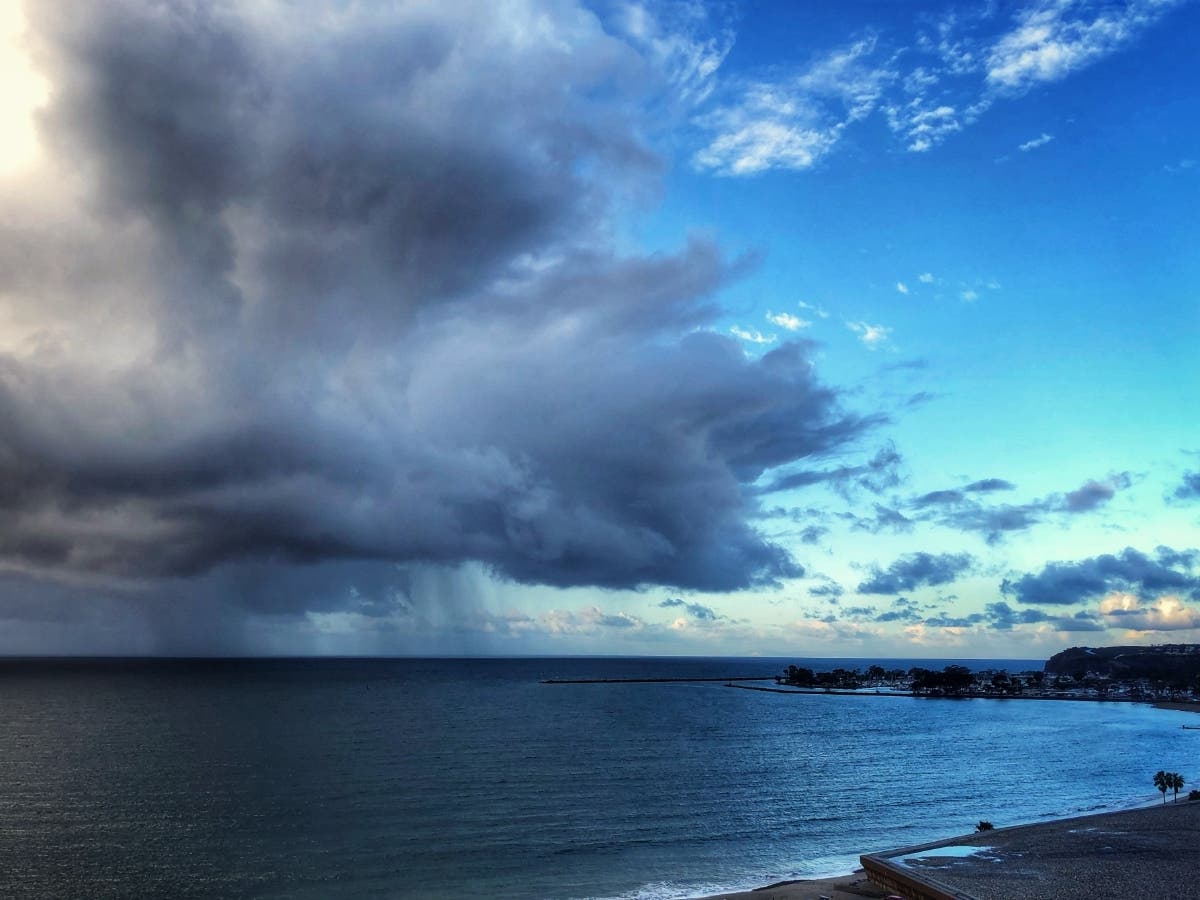 Dana Point, watching the coming storm. Beach advisories were underway after a frigid storm slammed into Orange County early Wednesday.