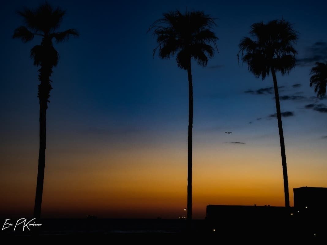 Guiding Light, a photo of Huntington Beach at twilight.