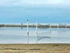 Zuma Beach's volleyball courts flooded over the weekend after big waves and high tides.