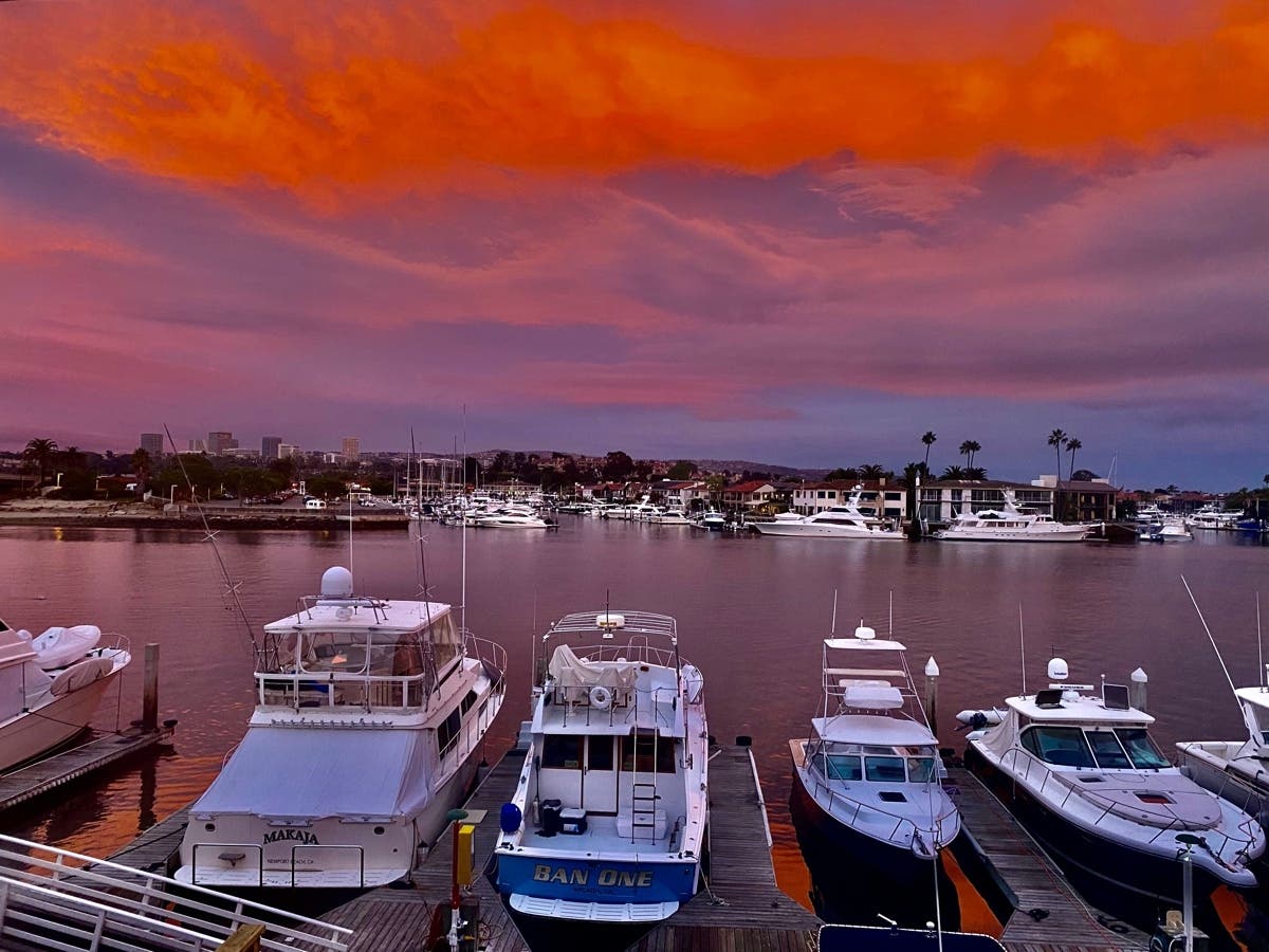 Newport Beach resident Carrie Garfield's sunset photo shows the beauty of Orange County even as the beaches in Newport and Corona Del Mar are being cleansed of oil.