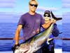 Rolene Rada with 65-pound yellowfin tuna, Dana Wharf deckhand. 