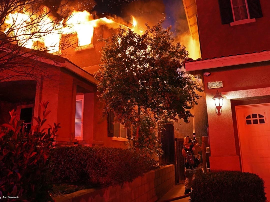 Firefighters arrived at a Murrieta home where flames erupted from upstairs windows.