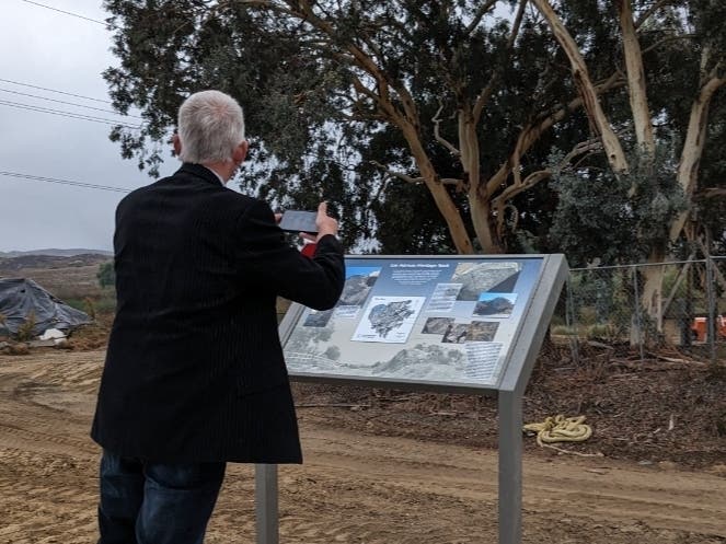 Local historian and Temecula Mayor James "Stew" Stewart taking in the new plaque commemorating the Los Alamos Heritage Rock, formerly known as the Leonard Smohl Memorial Rock near French Valley and Murrieta.