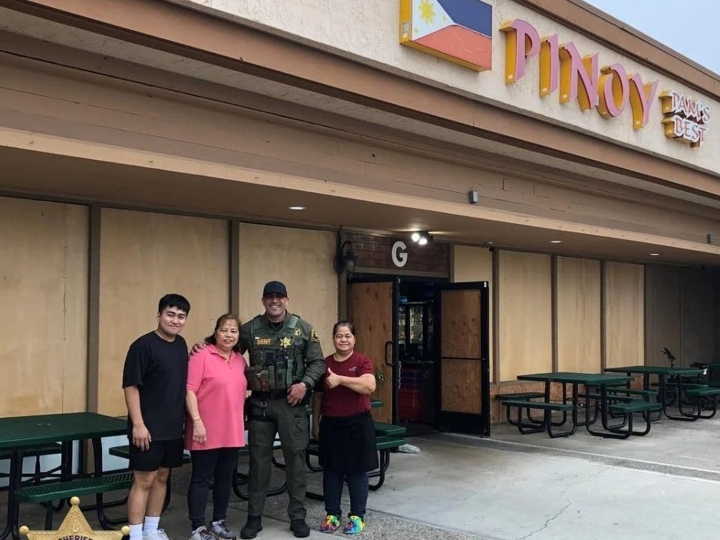 Lake Forest Deputy Carrillo, with Pinoy Pam's Best restaurant founder and family following the arrest of the suspected vandal.