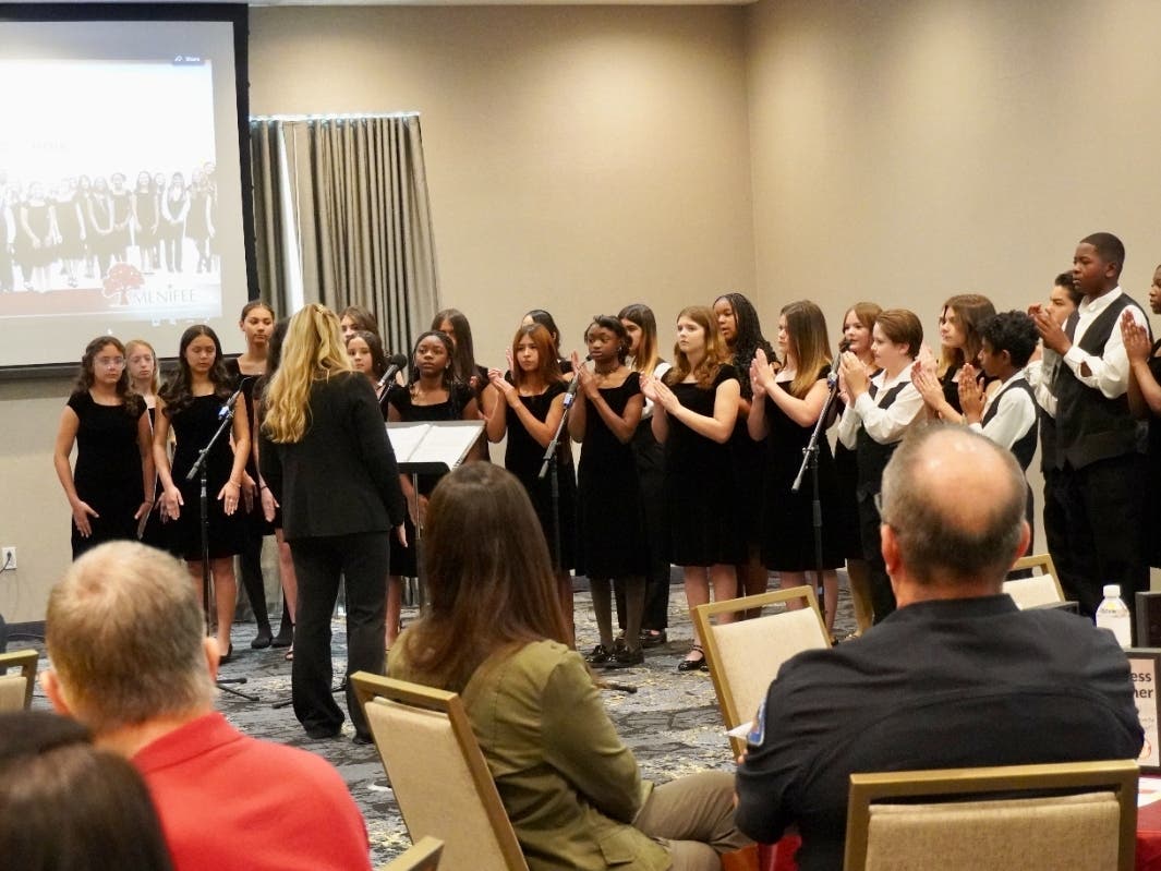 Students from the Menifee Valley Middle School (MVMS) Choir perform for over 160 community
leaders and guests. The performance was a highlight of the district's showcase of student talent and academic success.