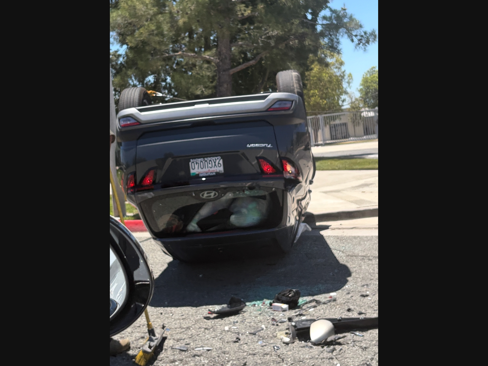 Following a dramatic crash, an overturned Hyundai Tucson awaits towing outside of Temecula Middle School.