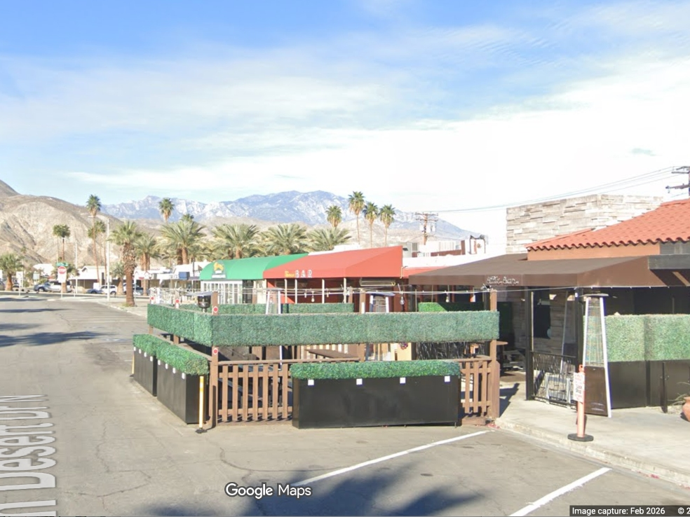 The deck that sits in parking spaces in front of the Palm Desert bar must come down on Monday.