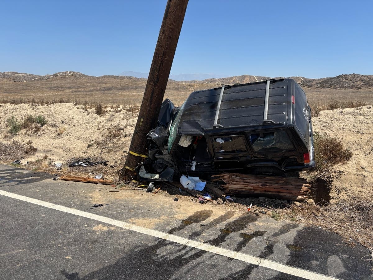 Vehicle smashes into power pole, injuring one person.