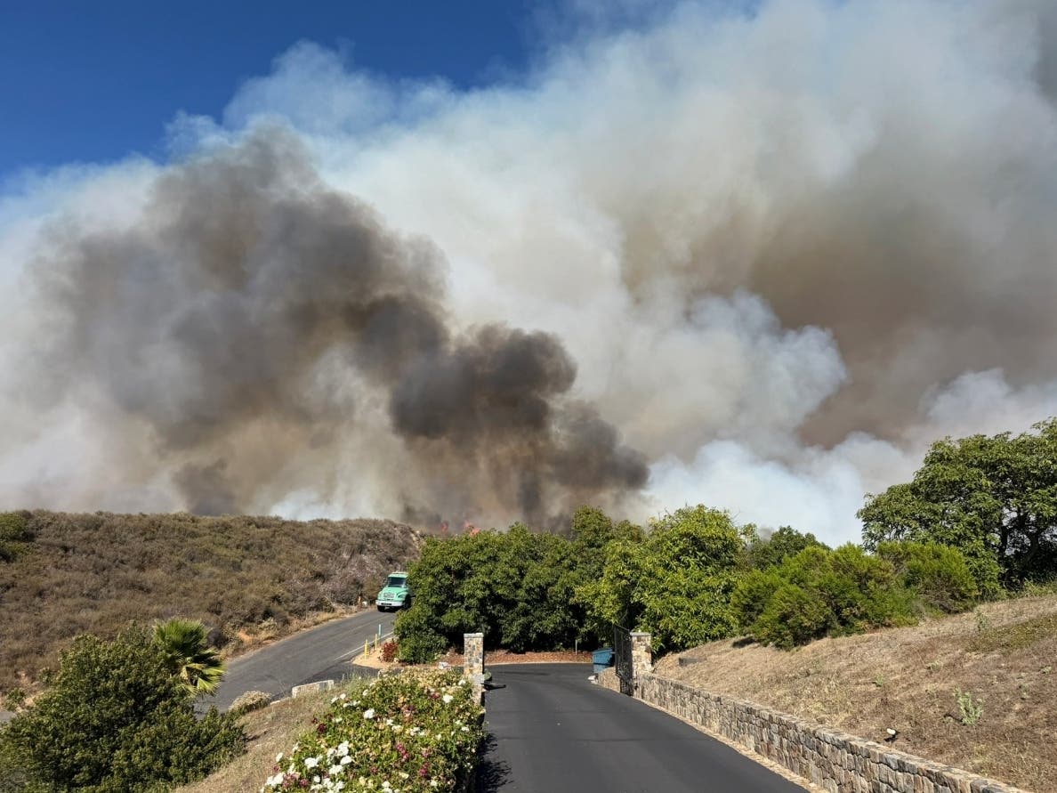 The Volcano Fire smoke cloud rises Tuesday above Murrieta.