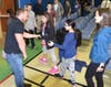 Navy SEAL Shane Anderson greets students after the Wood Oaks Junior High Veterans Day assembly.