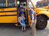 Fairview School principal Dan Ophus greets students as they arrive for the first day of school.