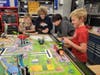 Eighth graders test robots they created as part of MacArthur Middle School's new dual-credit Robotics class.
