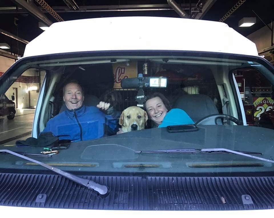 Claudette Dirsmith, founder of ARR Deerfield Pup Stop, and her husband, Tim, seated in the ARR (Alabama Rescue Relay) van at the Deerfield-Bannockburn Fire Dept. with a few of the amazing dogs that are cared for and transported to Wisconsin and Illinois.