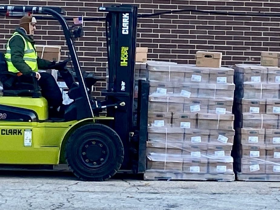 A volunteer moves two large pallets (each pallet holds 2,000 pounds of frozen chicken) during “Poultry to Pantries Day” hosted by Hunger Resource Network twice a year when 120,000 pounds of frozen chicken are distributed throughout the Chicagoland area. 