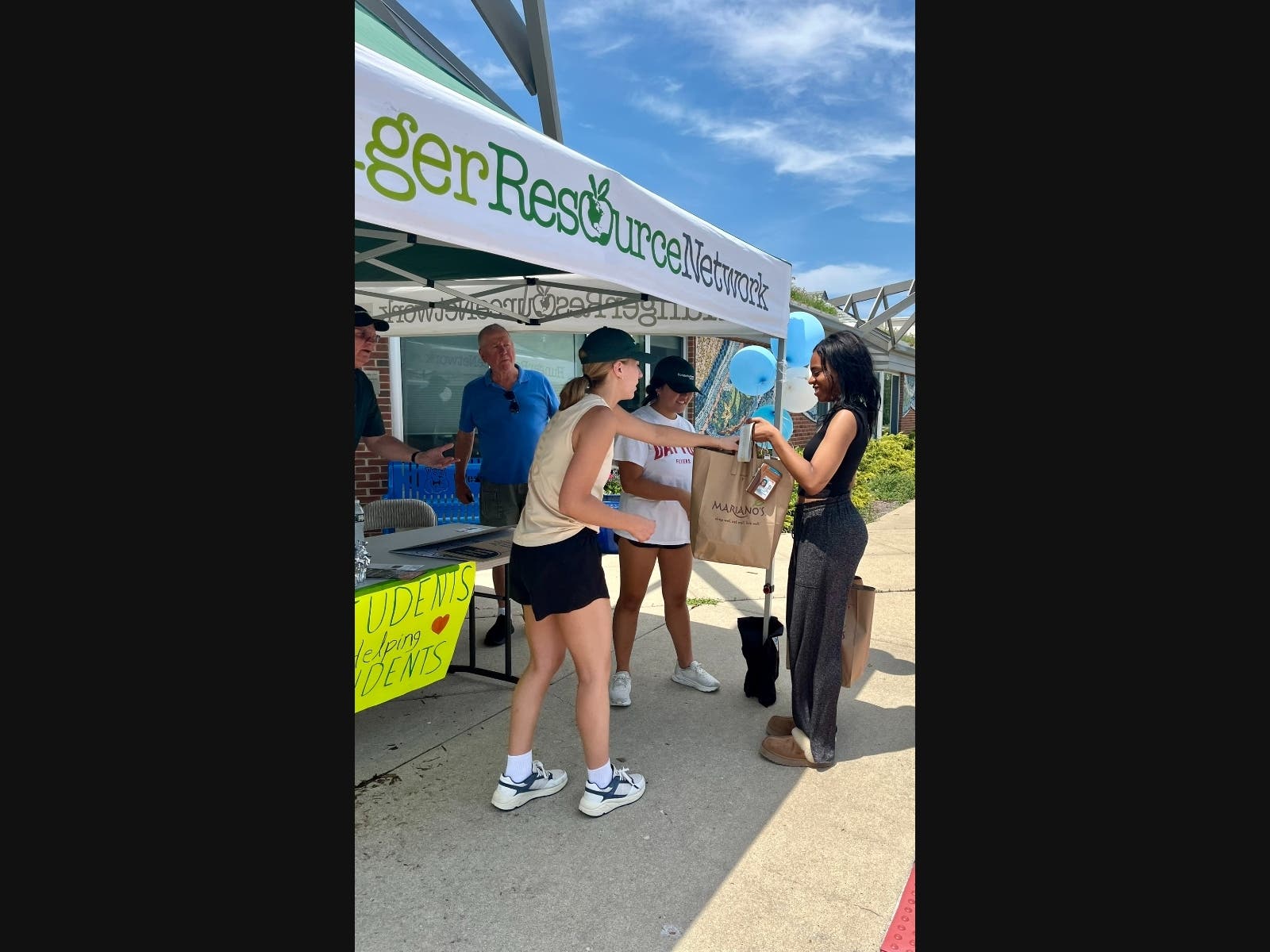 Students accept donations of personal care items for financially challenged families at the recent “Students Helping Students” collection event held recently at Westmoor Elementary School, Northbrook. Hunger Resource Network helps coordinate the program. 