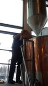 Rock Bottom Brewer Iain Wilson prepares the beer for the Orland Park History Museum April 24 seminar.