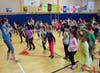  Unqua Elementary School physical education teacher Melissa Osborne led students in dancing.