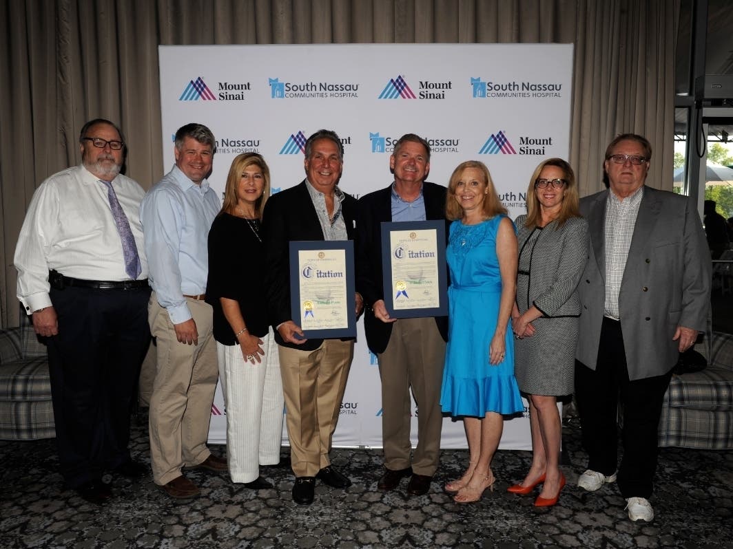 Local elected officials joined co-honorees and their wives at the golf outing.