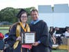 James Brown presented Class of 2019 salutatorian Andriana Patmanidis with a commemorative plague prior to her address.