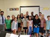 Superintendent of Schools Dr. Melissa Burak (front, third from right) and Lynbrook North Middle School Principal Sean Fallon (back right) welcomed Jason Melecio (left) and his sixth grade music class back. 