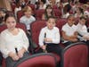 Lindell students enjoyed the new auditorium seating prior to taking the stage for their winter concert, while parents and other guests applauded from the audience.