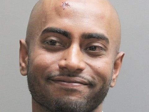 Nassau Police say Emad Newaz threatened to blow up the precinct during his arrest processing.