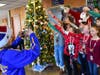 Berner Middle School student council President Josh Holden snapped a picture at the holiday photo booth, with participants making donations to help families within the community.