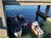 Firefighters canvassed the water under the Long Beach Bridge, looking for the fallen worker.