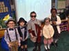 Kindergartners, from left, Marco Artale, Jaxson McMahon, Veronica Calise, Claire DeGiorgio and Eliana Boafo-Amissah did their best centenarian impressions. 