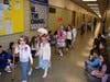 Dressed up as 100-year-olds, East Lake kindergartners paraded through the school.