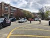 Newbridge Road Elementary School teachers and staff gathered in front of the school on April 14 for a car parade to say goodbye to two students who are moving out of state.